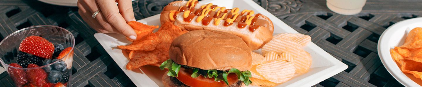 Burger and hot dog served on Chinet Classic plate