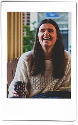 Woman laughing and holding a Chinet Comfort cup