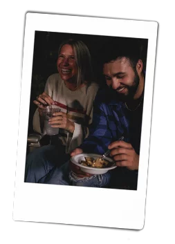 Instax picture of a man eating dessert out of a Chinet Classic bowl