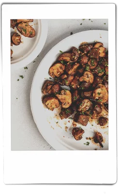 Instax picture of air fryer mushrooms served on a Chinet Classic plate