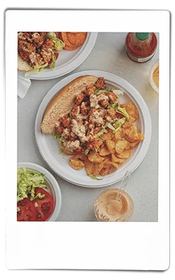 Crawfish po boy served on a Chinet Classic plate