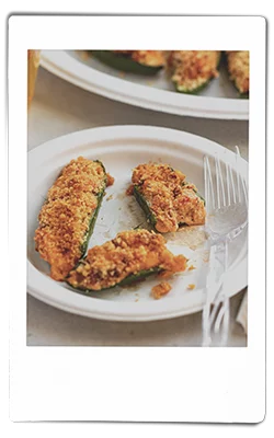 Instax picture of crawfish-stuffed jalapeno peppers served on a Chinet Classic plate