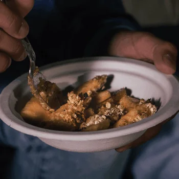Eating apple crisp out of a Chinet Classic® Bowl
