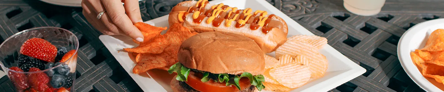 Burger and hot dog served on Chinet Classic plate